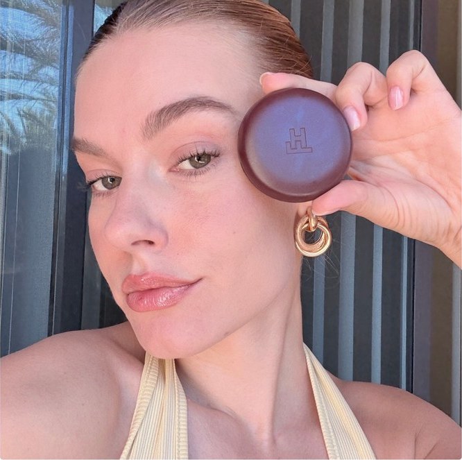 Close-up beauty portrait holding a compact