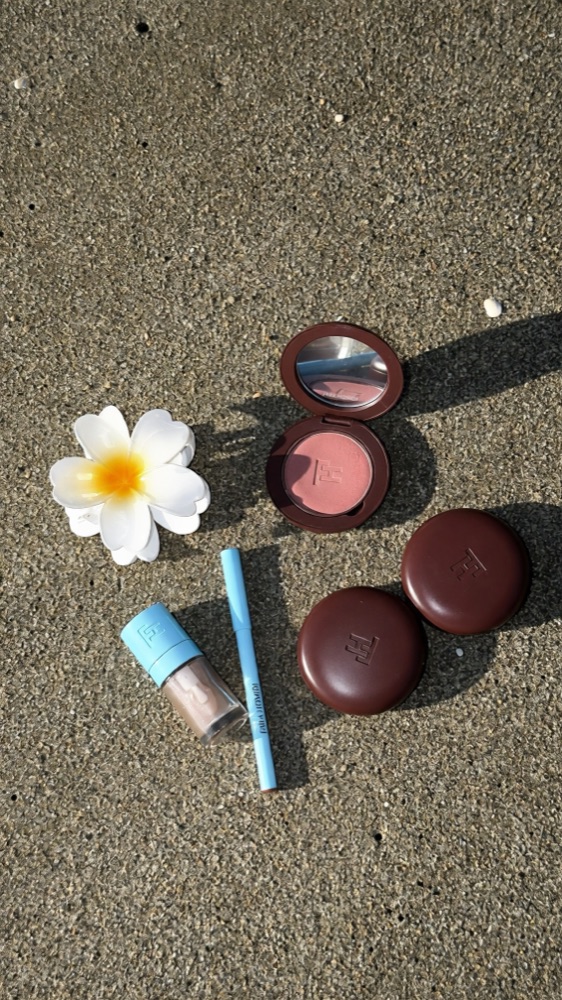 Fara Homidi blush compact, lip gloss and liner on wet sand